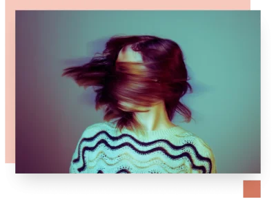 Teen shaking head in motion blur