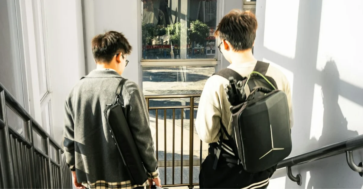 2-college-kids-walking-down-stairs