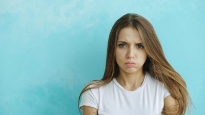 A young woman with a displeased expression