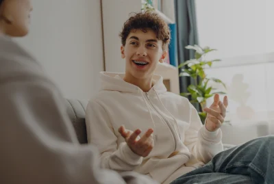 Teenage boy talking with therapist
