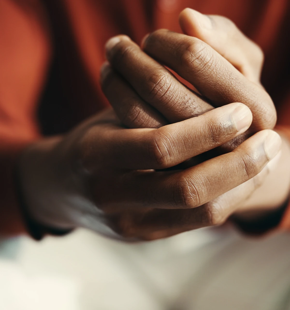 close up of hands clasped