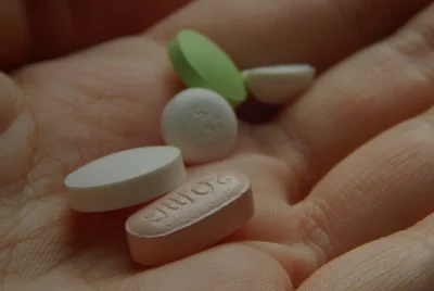 various pills on palm of hand