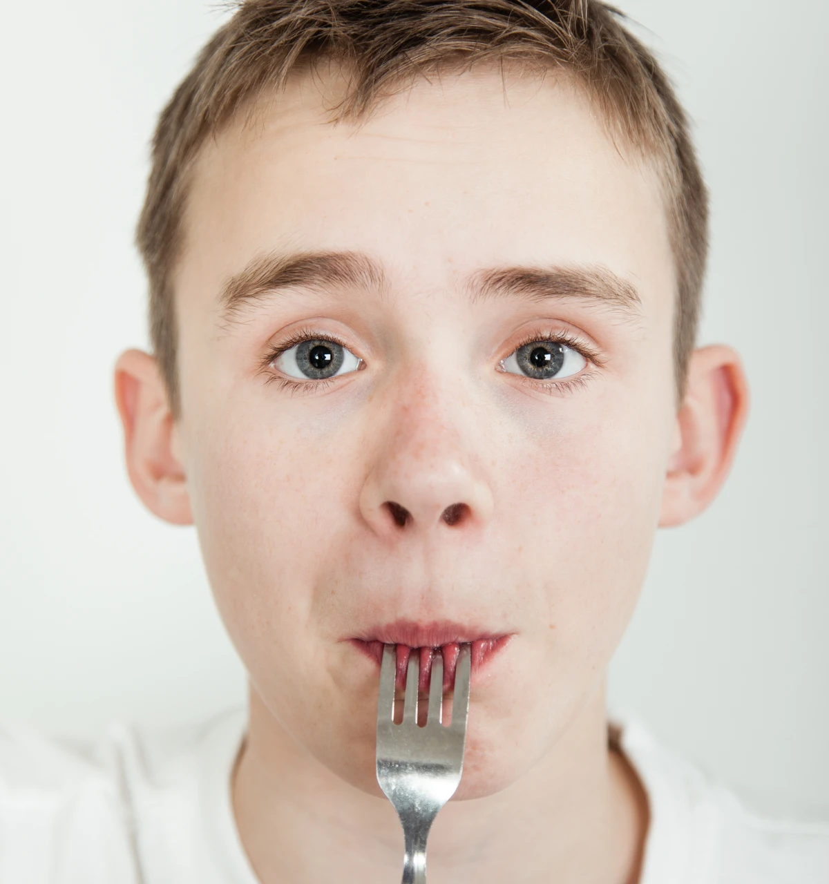 boy-with-fork-in-mouth