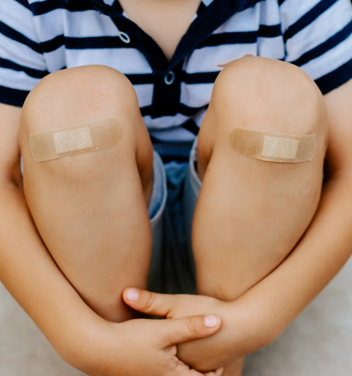 boy-with-plasters-on-knees