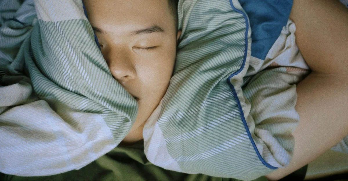 teen-asleep-with-duvet