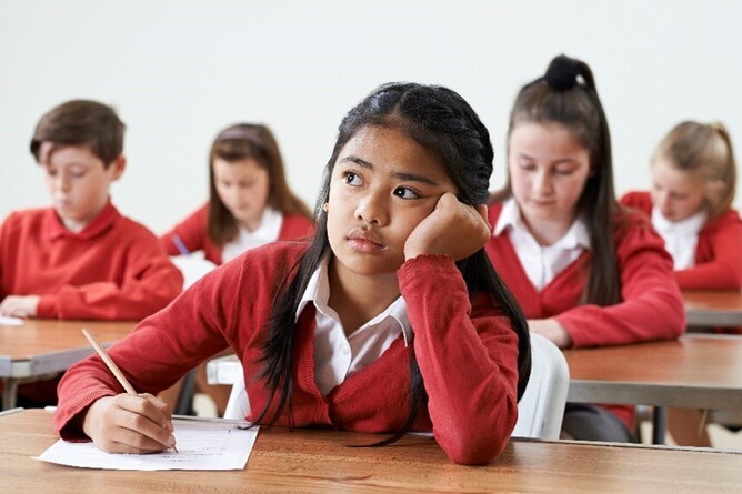 A student revising at a desk